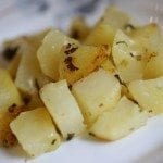 Batatas amanteigadas com alho e coentros
